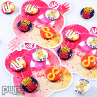 Closeup of Uniquely Shaped Die Cut Button Packs by Life Design