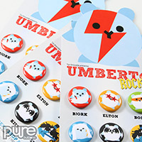 Closeup of Umberto Rocks Button Packs Featuring Six One Inch Round Custom Buttons