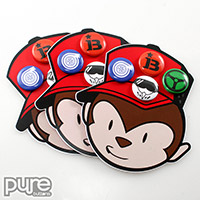 Die Cut Button Packs Shaped Like a Cartoon Monkey Head with Four Pin-Back Buttons Attached